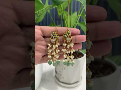 Beautiful earrings with peacock design and pearls